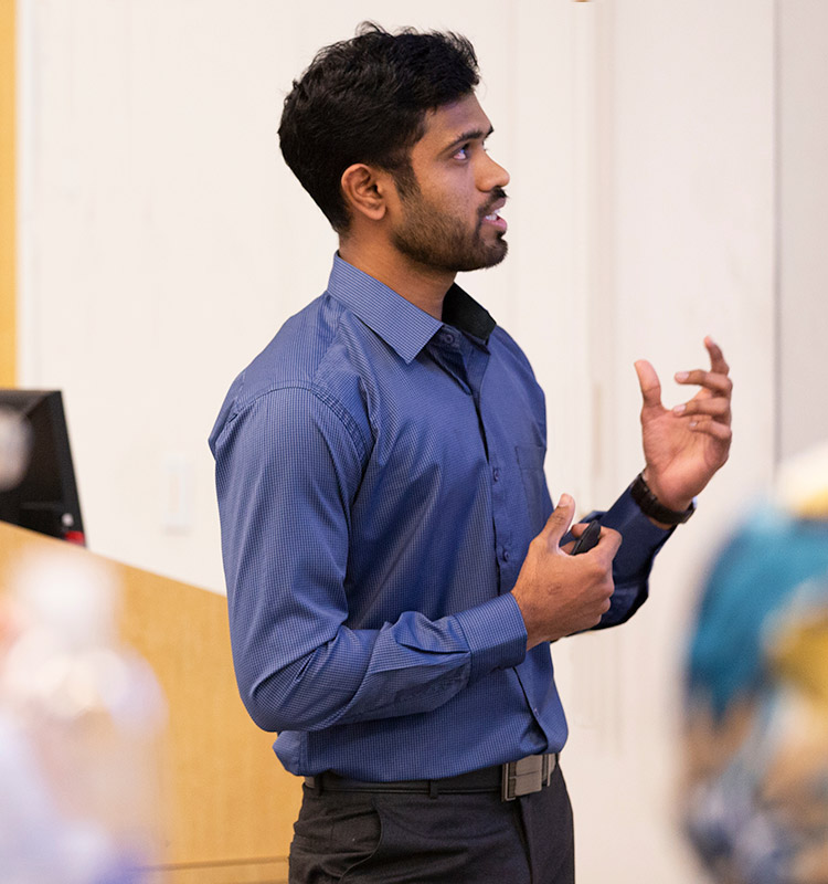Student presenting in front of class