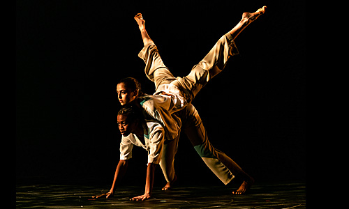 Two dancers performing on stage