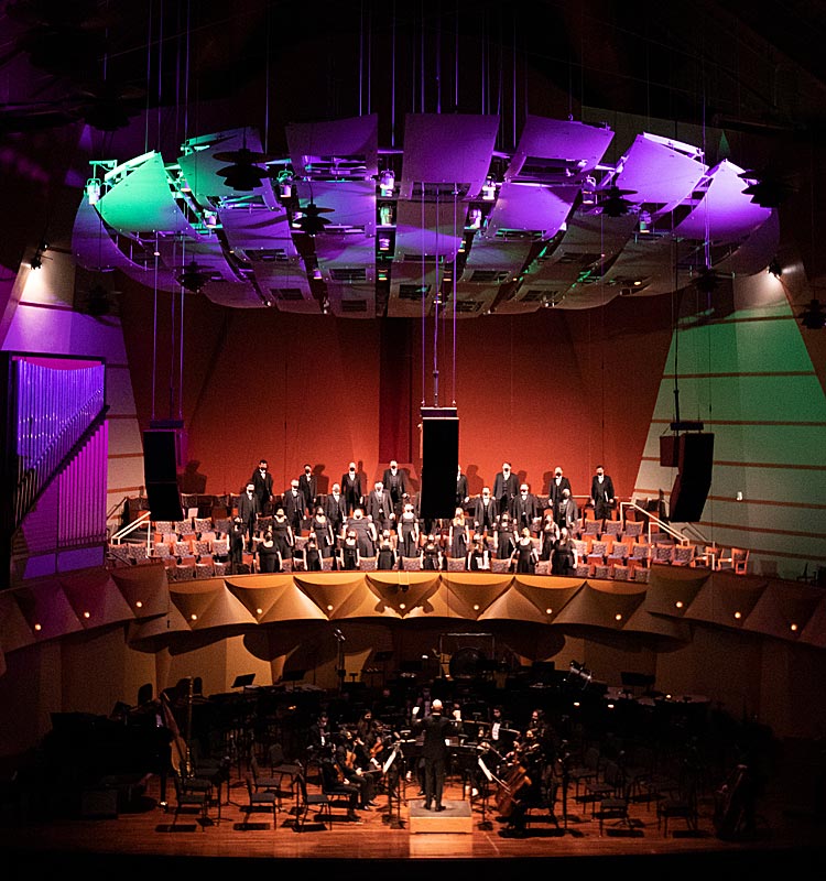 Symphony and singers performing at Meng Concert Hall