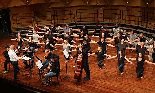 University Singers rehearsing on stage