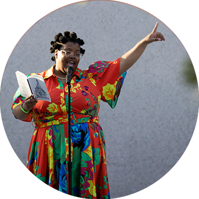 A lecturer reading a passage from a book