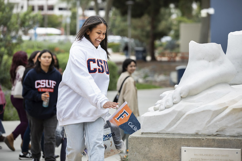 Student and the statue of David at CSUF